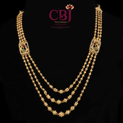 Traditional 3 line ball chain necklace with 2 side pendants feating a peacock design.