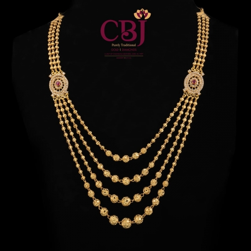 A simple 4 line ball chain necklace with 2 side pendants.