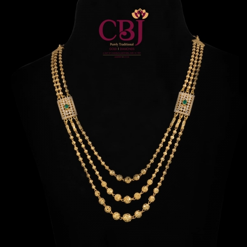 3 line ball chain necklace featuring 2 side pendants bejewelled with CZ stones.
