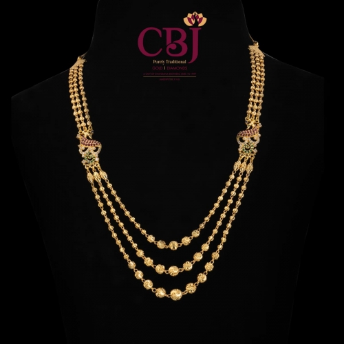 This pure 22k gold ball chain necklace features 3 lines and 2 side pendants.