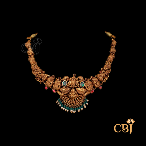 Short-length 12 grams Nakshi gold necklace with antique finish, showing detailed craftsmanship, compact structure, and traditional design patterns.
