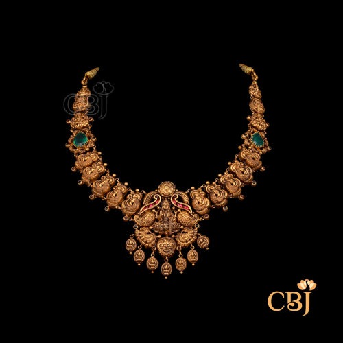 20 grams antique lightweight Nakshi short necklace shown as a gold necklace with detailed Nakshi motifs, antique finish, and a close neckline fit.