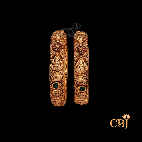 29 grams Nakshi Antique Bangles displayed as a pair of gold bangles with temple-style Nakshi carvings and antique finish
