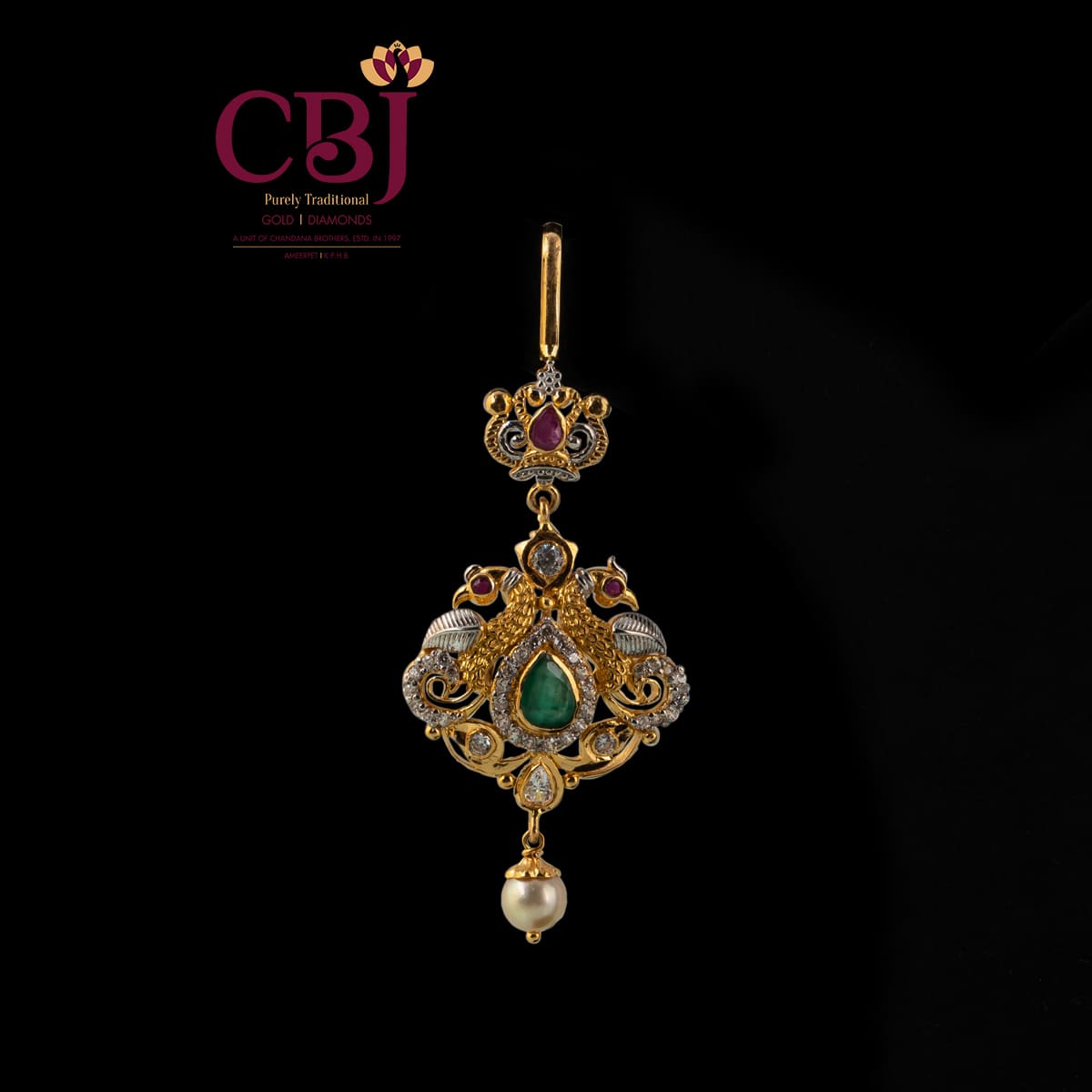 Peacocks are the highlight in this one of a kind maang tikka featuring CZ's.