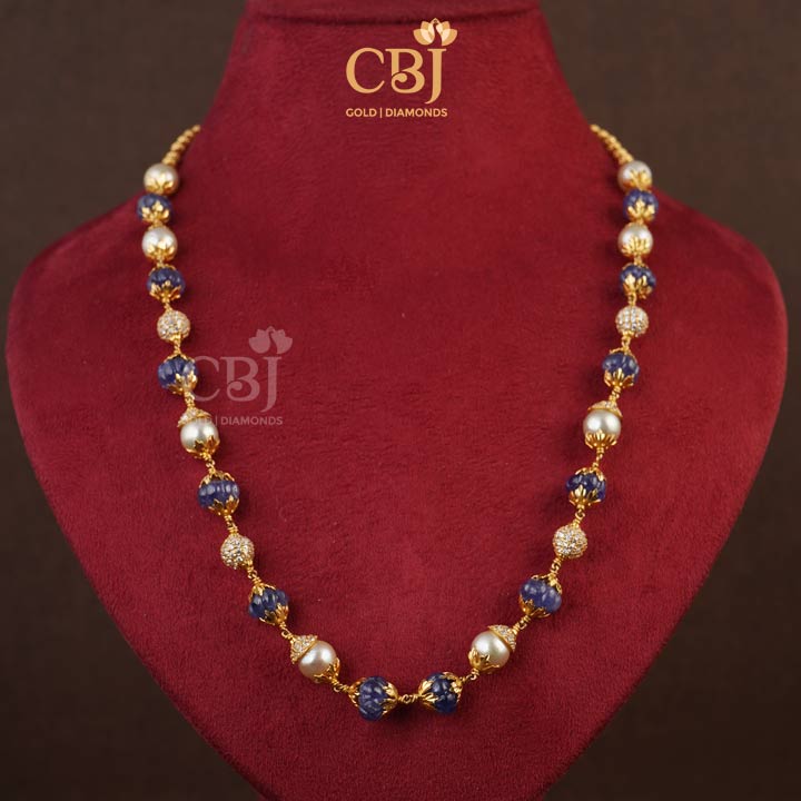 A simple mala featuring a combination of unique blue sapphire stones and pearls.