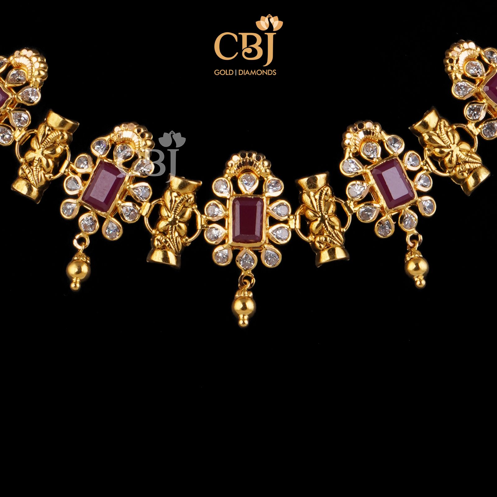 A slender design featuring ruby stones surrounded by stunning czs.
