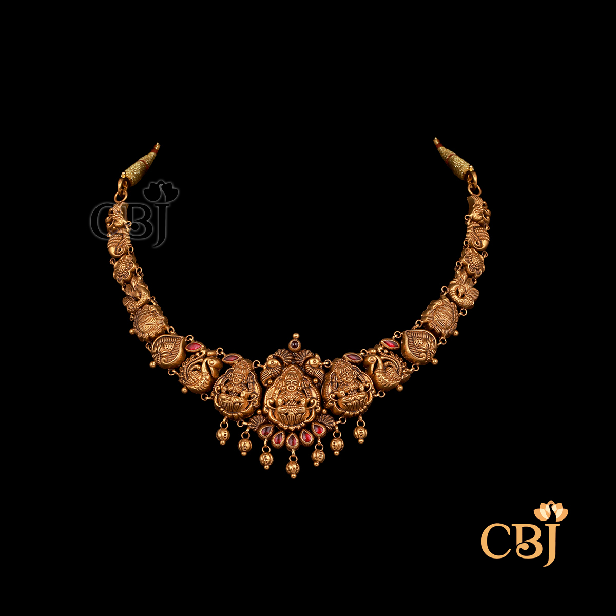 Lightweight 9 grams Nakshi short gold necklace with subtle handcrafted detailing and traditional design elements.