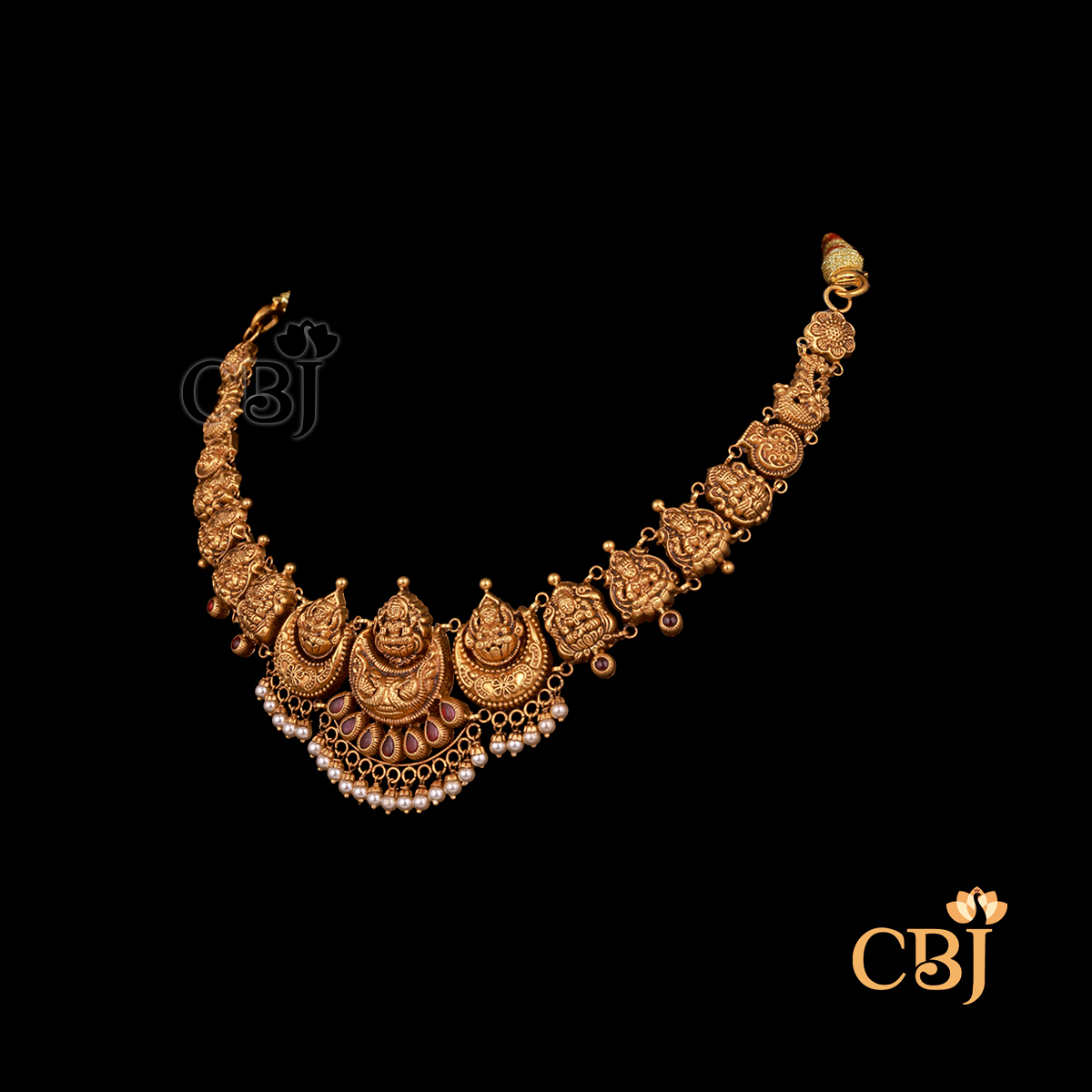9 grams antique lightweight Nakshi Necklace shown as a delicate gold necklace with carved Nakshi detailing
