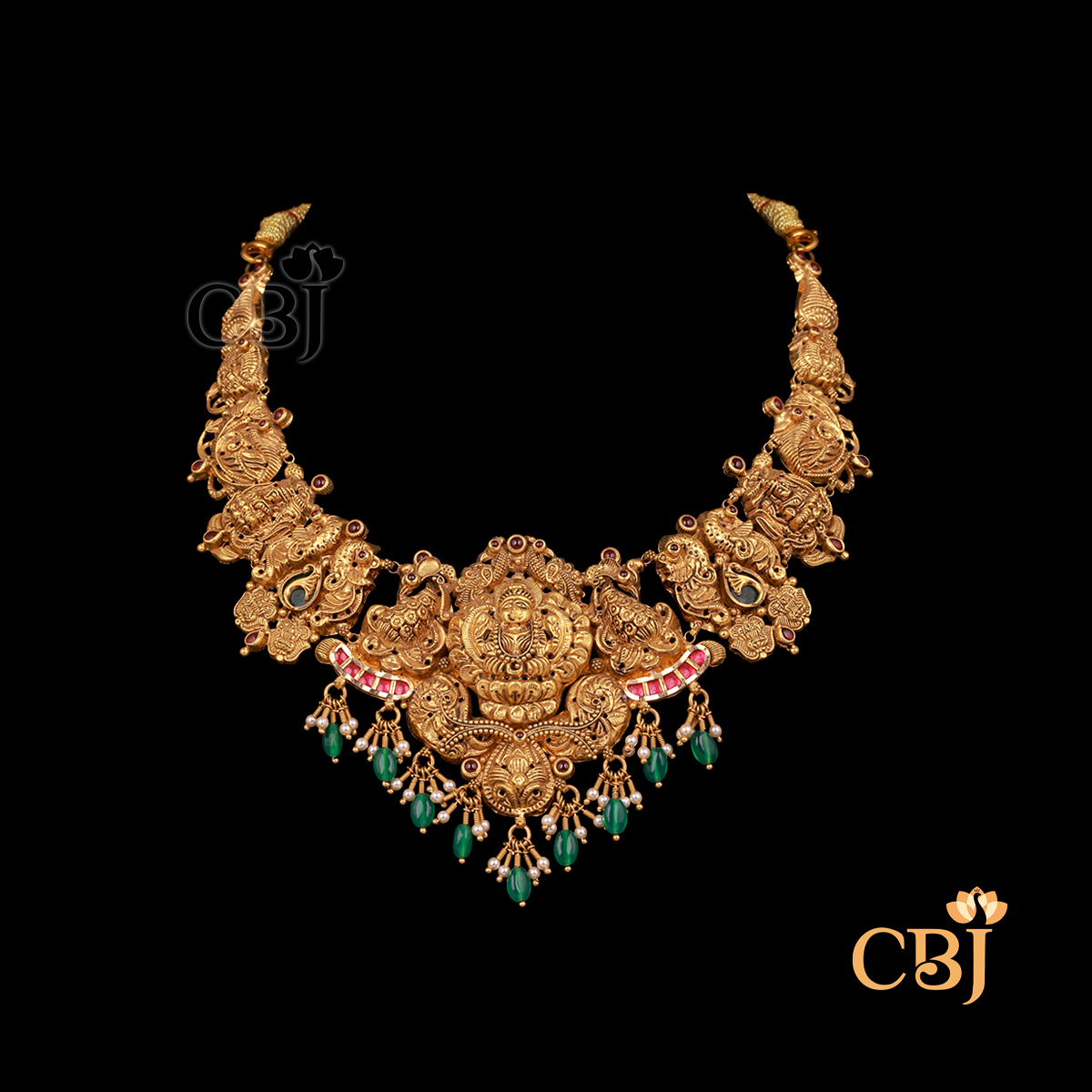 28 grams antique lightweight Nakshi Necklace shown as a gold necklace with carved Nakshi detailing