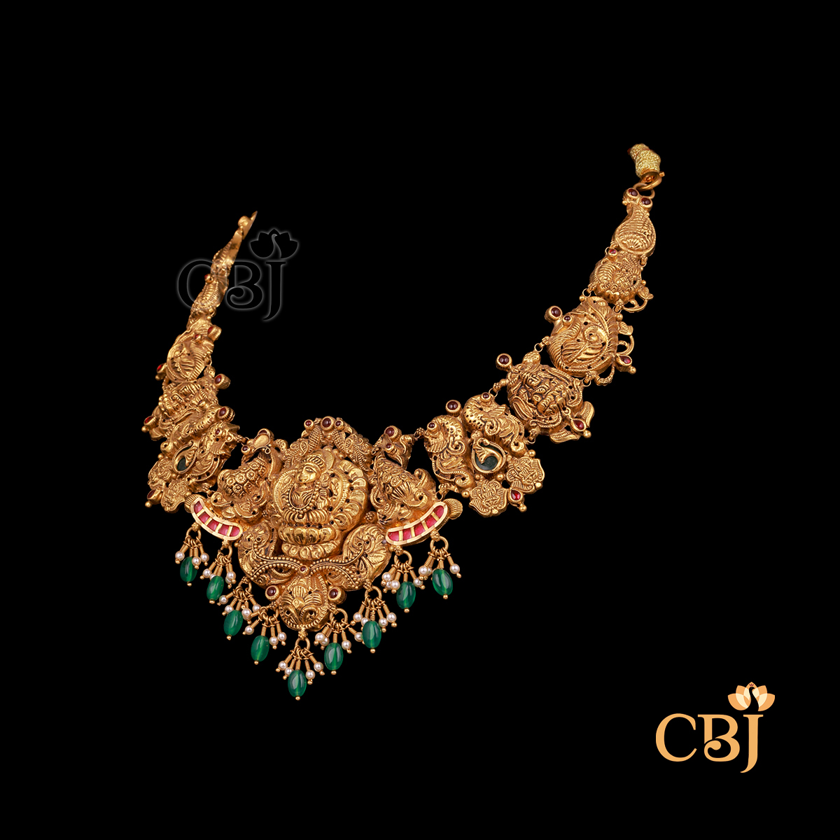28 grams antique lightweight Nakshi Necklace shown as a gold necklace with carved Nakshi detailing
