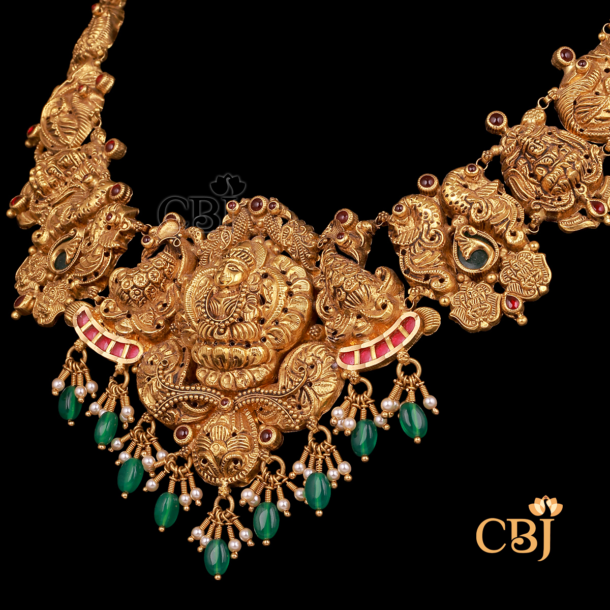 28 grams antique lightweight Nakshi Necklace shown as a gold necklace with carved Nakshi detailing