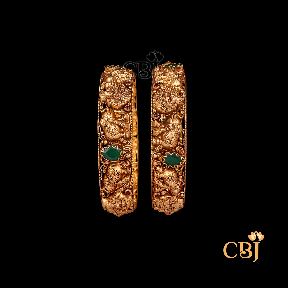 33 grams Nakshi Antique Bangles shown as a pair of gold bangles with ornate Nakshi carving work