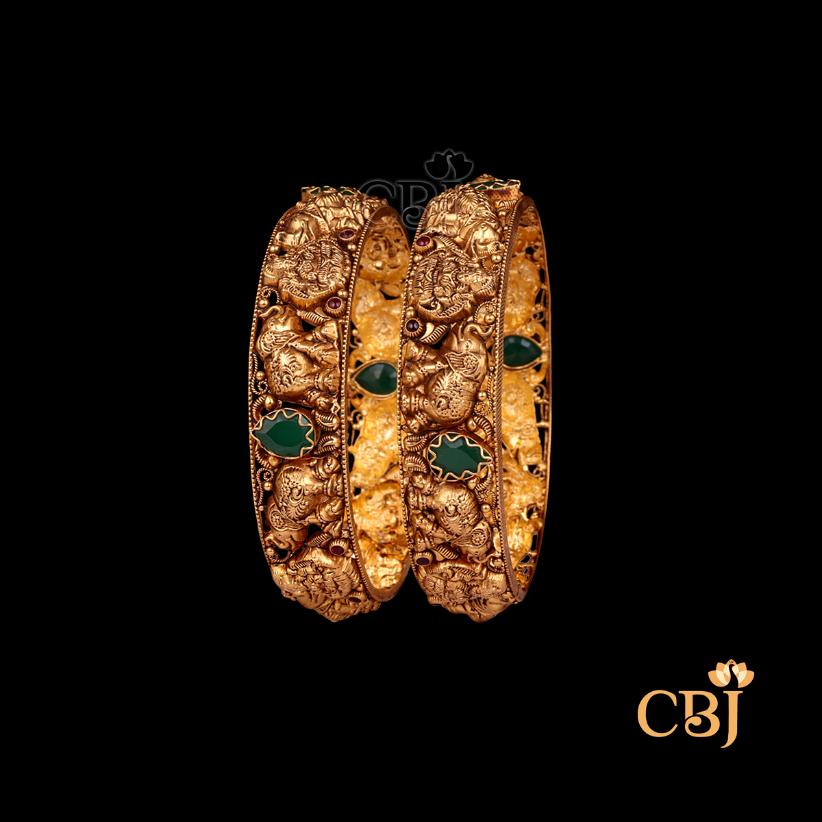33 grams Nakshi Antique Bangles shown as a pair of gold bangles with ornate Nakshi carving work