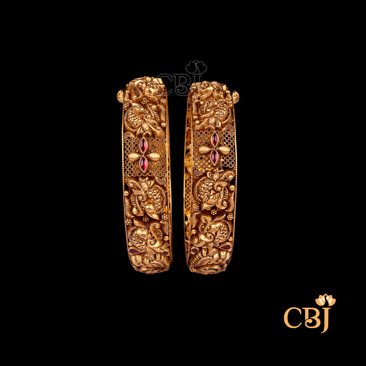 36 grams Nakshi Antique Bangles displayed as a pair of gold bangles with detailed Nakshi carvings