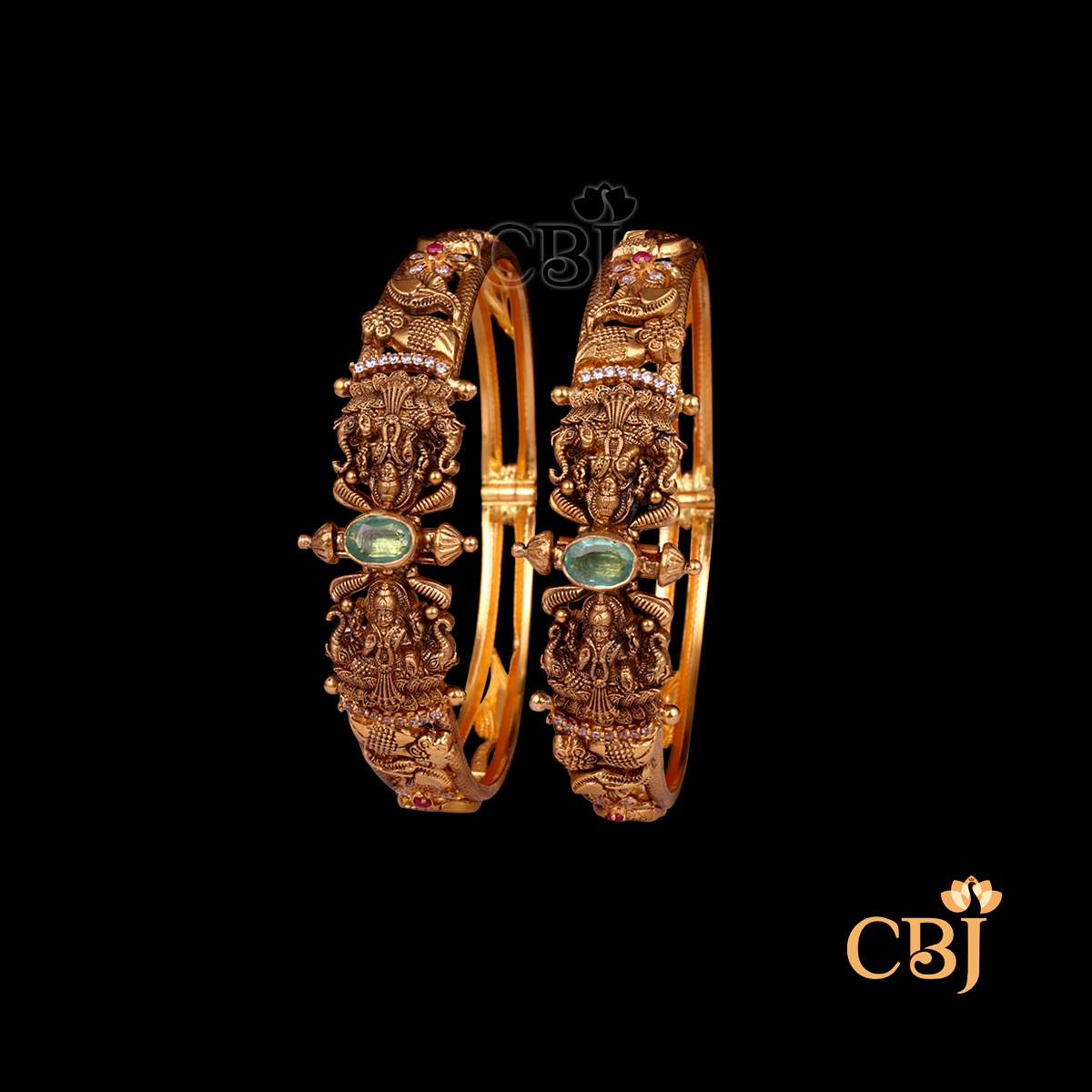 31 grams Nakshi Antique Bangles displayed as a pair of gold bangles with detailed Nakshi carvings