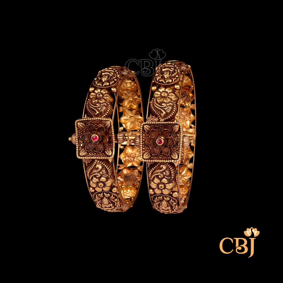 38 grams Nakshi Antique Bangles shown as a pair of traditional gold bangles with intricate Nakshi carvings