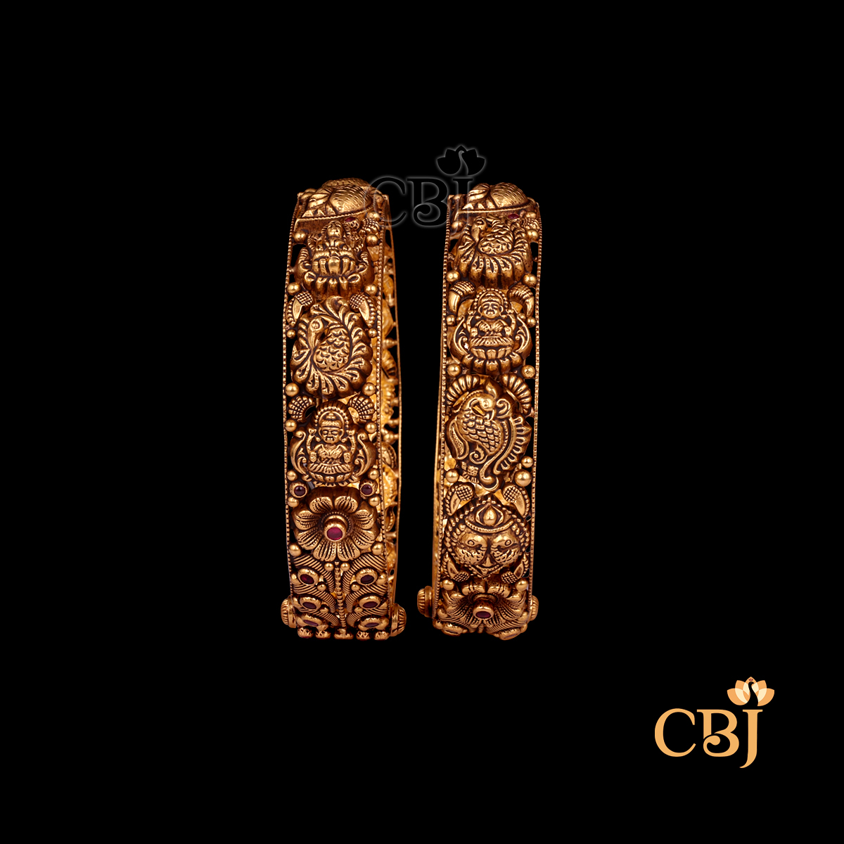 38 grams Nakshi Antique Bangles displayed as a pair of gold bangles with carved Nakshi detailing