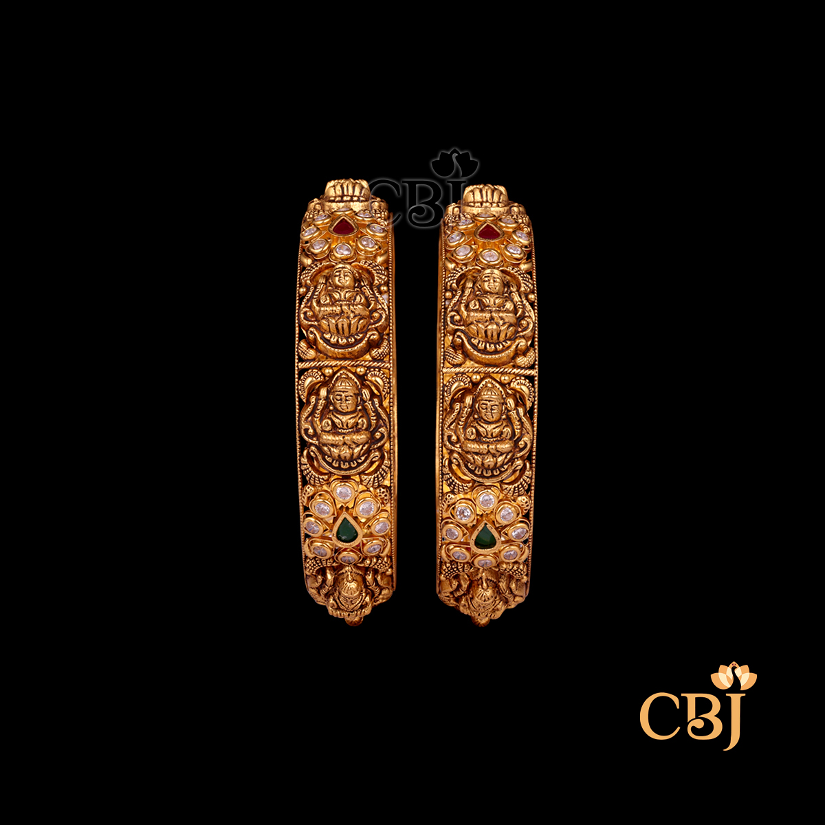 35 grams Nakshi Antique Bangles shown as a pair of gold bangles with detailed Nakshi carvings