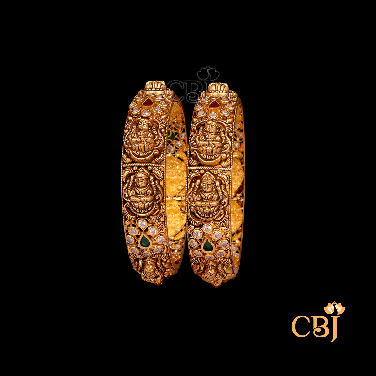 35 grams Nakshi Antique Bangles shown as a pair of gold bangles with detailed Nakshi carvings