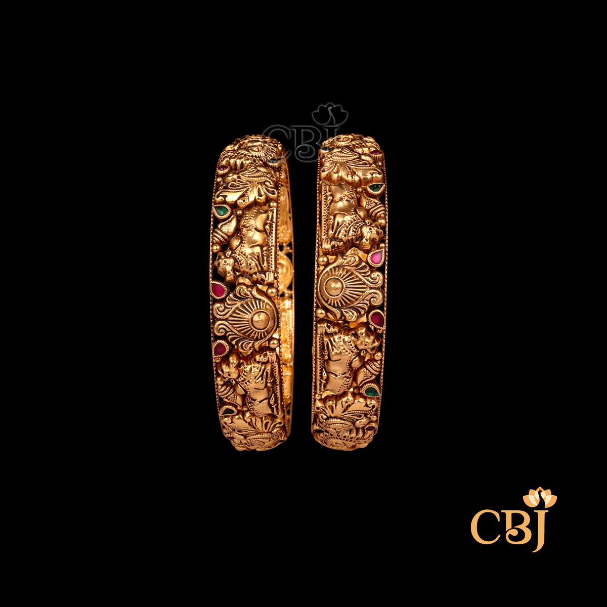 29 grams Nakshi Antique Bangles displayed as a pair of gold bangles with carved Nakshi patterns