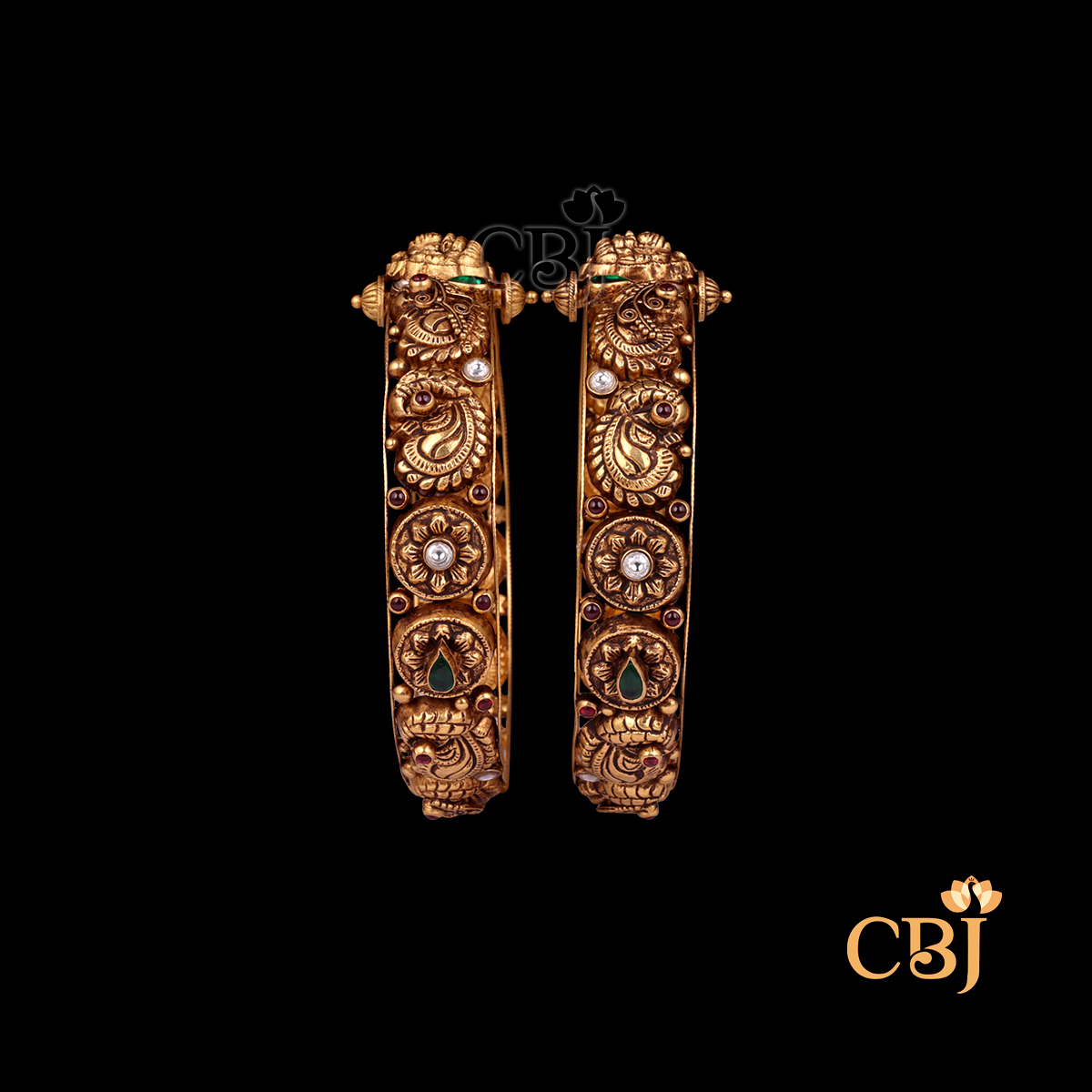 37 grams Nakshi Antique Bangles shown as a pair of gold bangles with carved Nakshi detailing